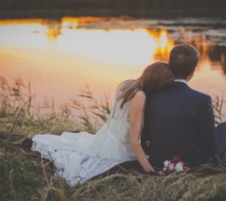 wedding photo of a couple by water