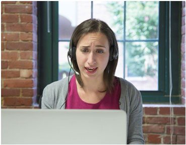 woman talking on headset in an office